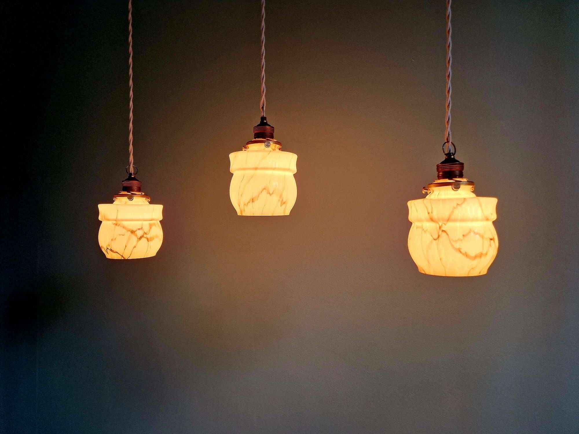 Art Deco trio of suspensions in opaline and marbled ouraline, Scailmont, 1920-30.