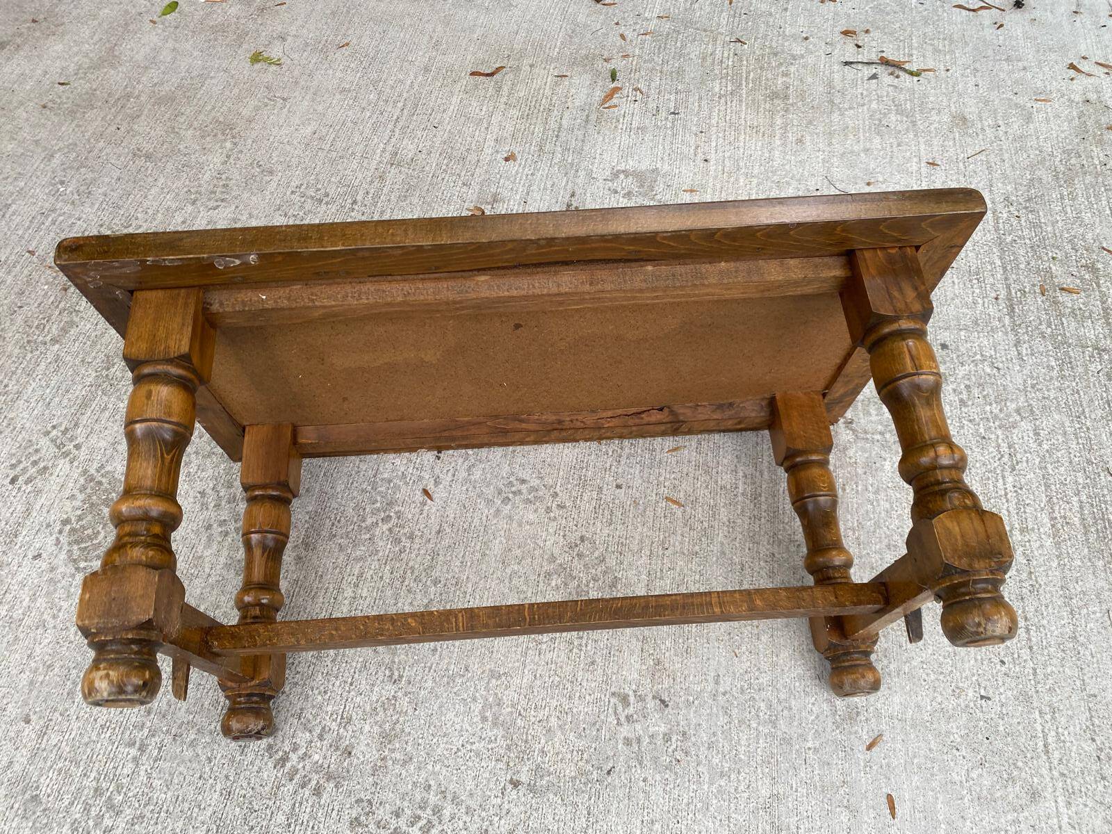 Vintage 70s coffee table with wood and ceramic tiles featuring bird and nature patterns.