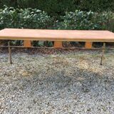 Vintage modernist table with metal tubular base and top covered with oilcloth.