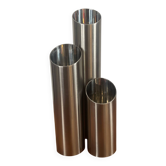 Vintage trio of brushed stainless steel candle holders