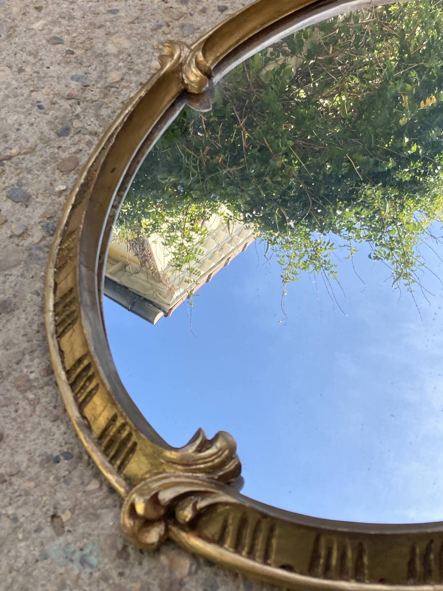Oval mirror - wood and gilded stucco with decoration of