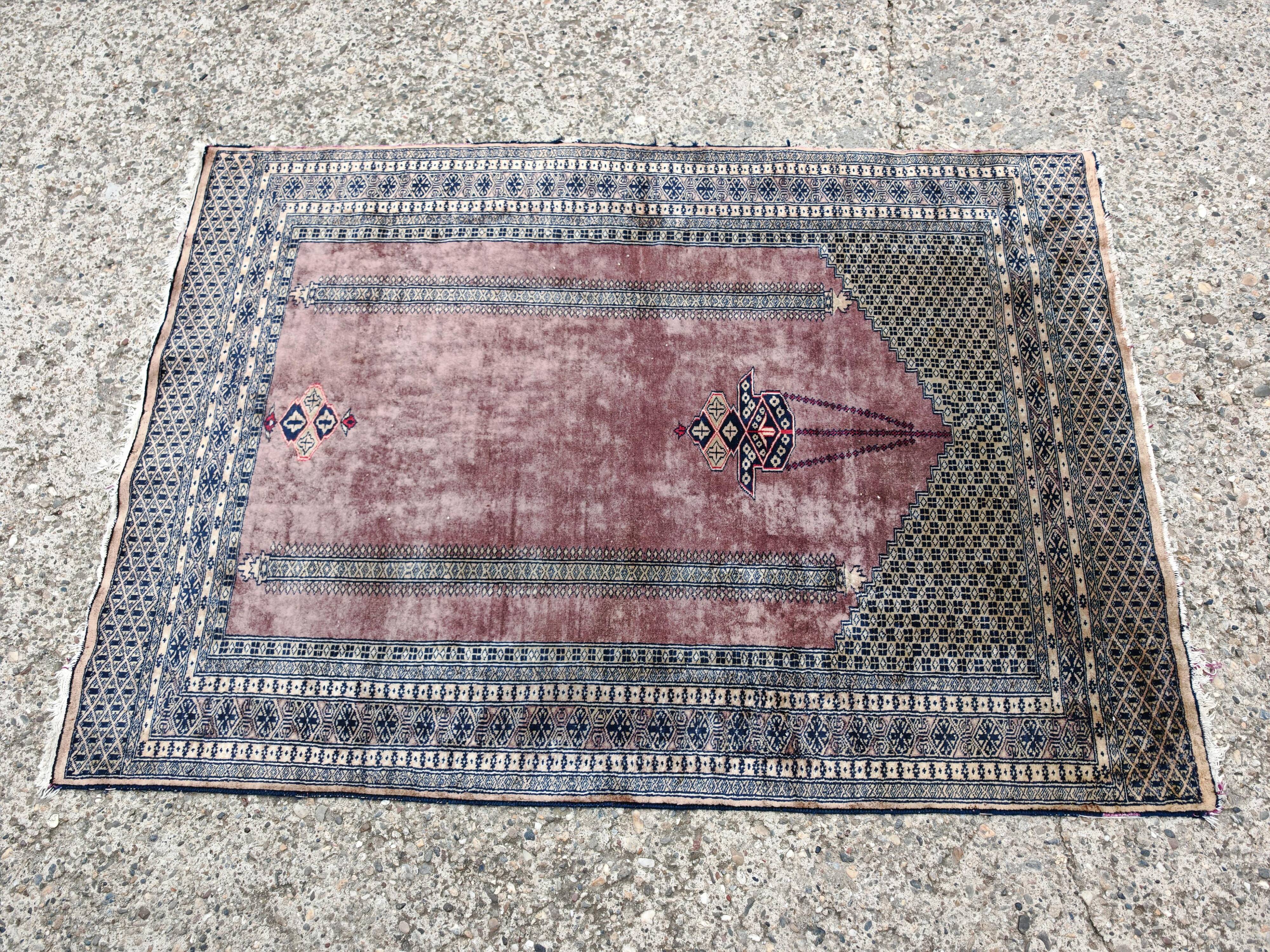 Vintage Anatolian prayer rug made of hand-knotted wool.