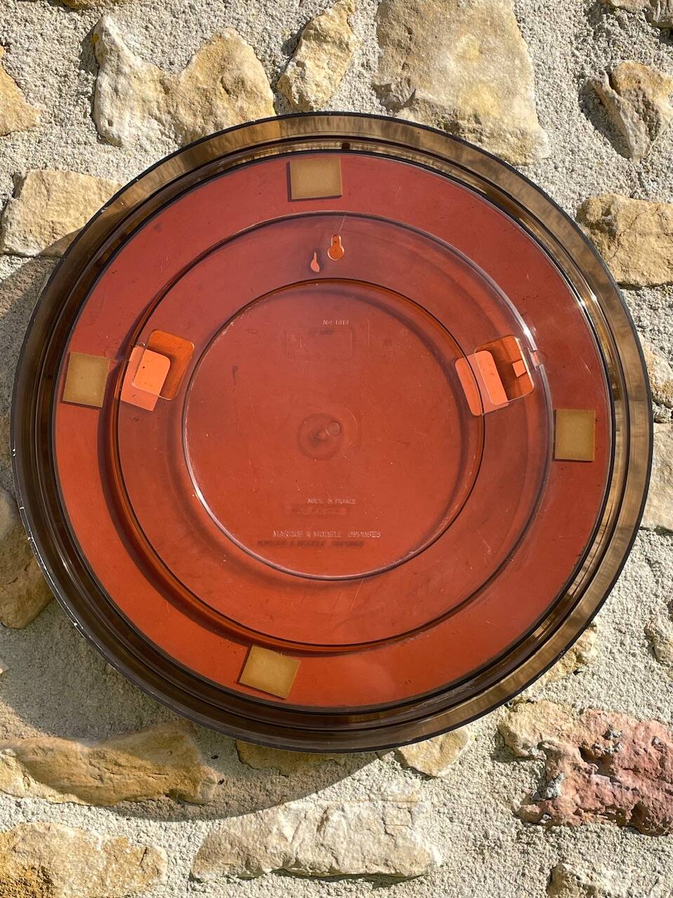 Vintage round smoked plastic mirror, circa 1970s.
