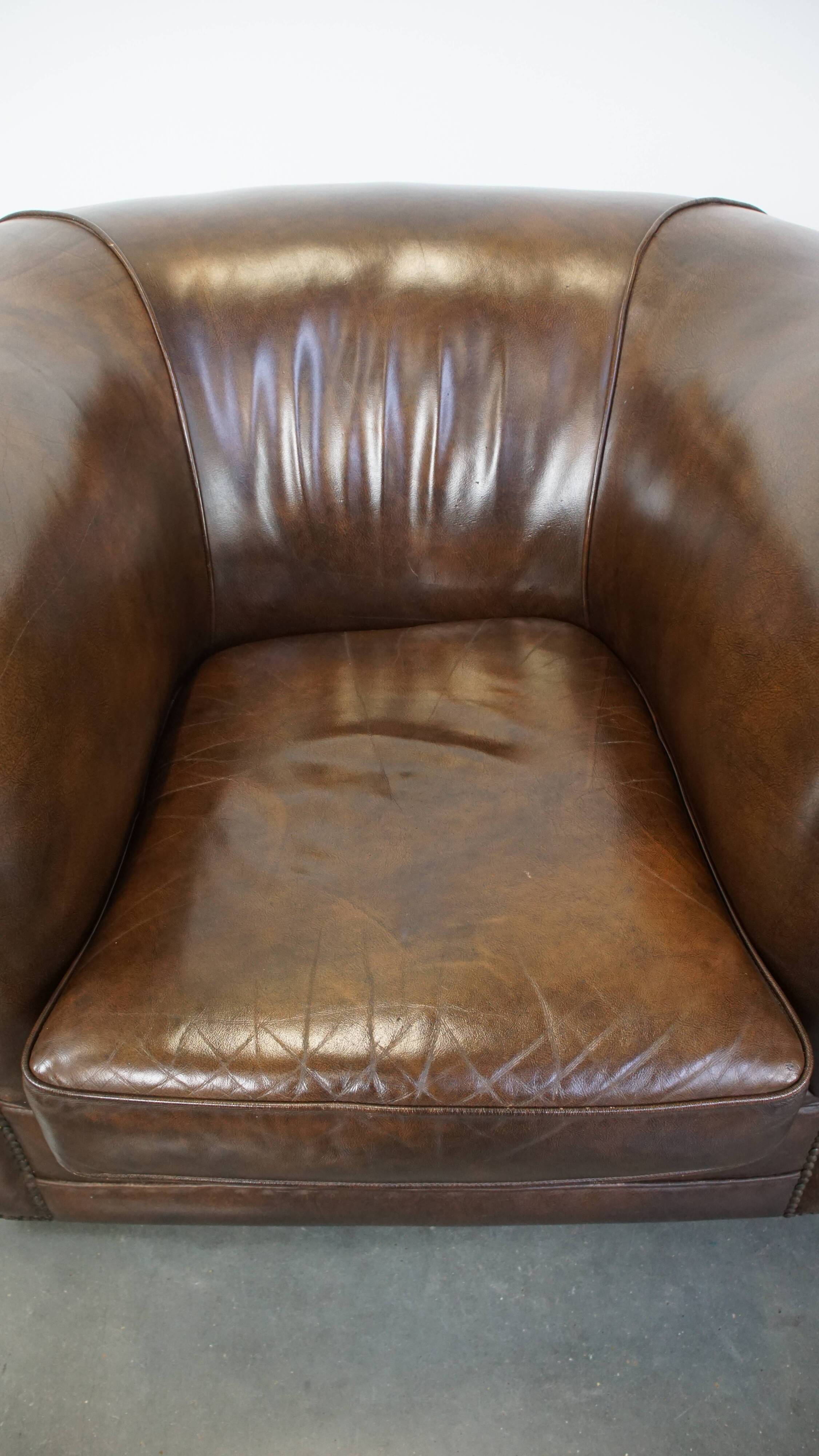 2 Chesterfield armchairs in dark brown cowhide