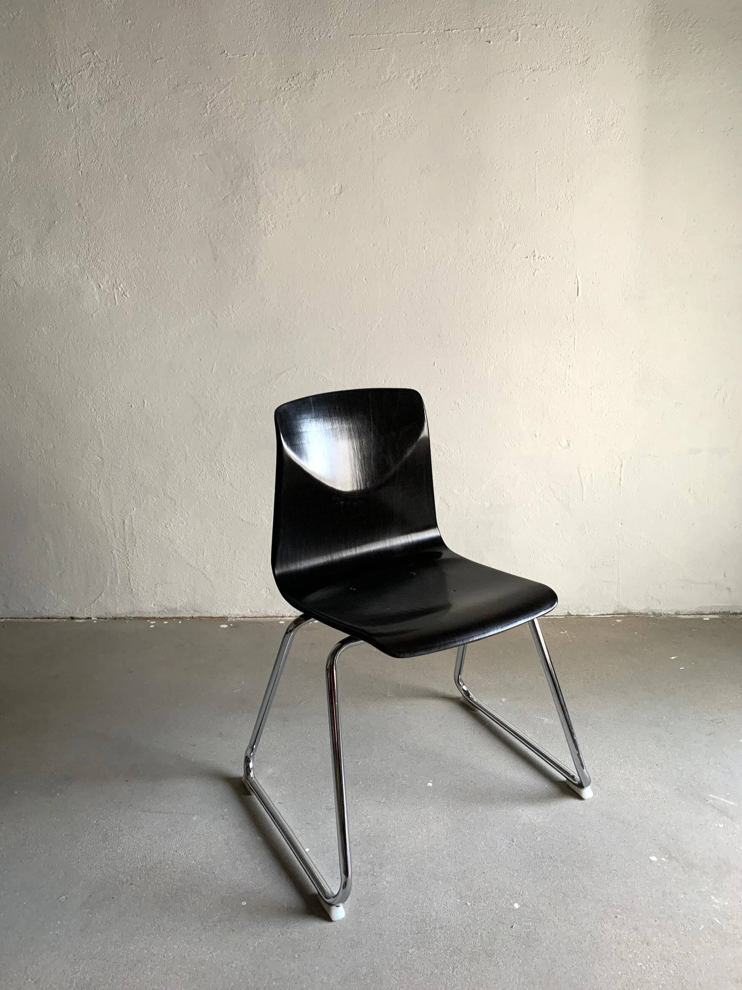 7 Pagholtz tubular steel stackable dining chairs | West Germany | 1960s