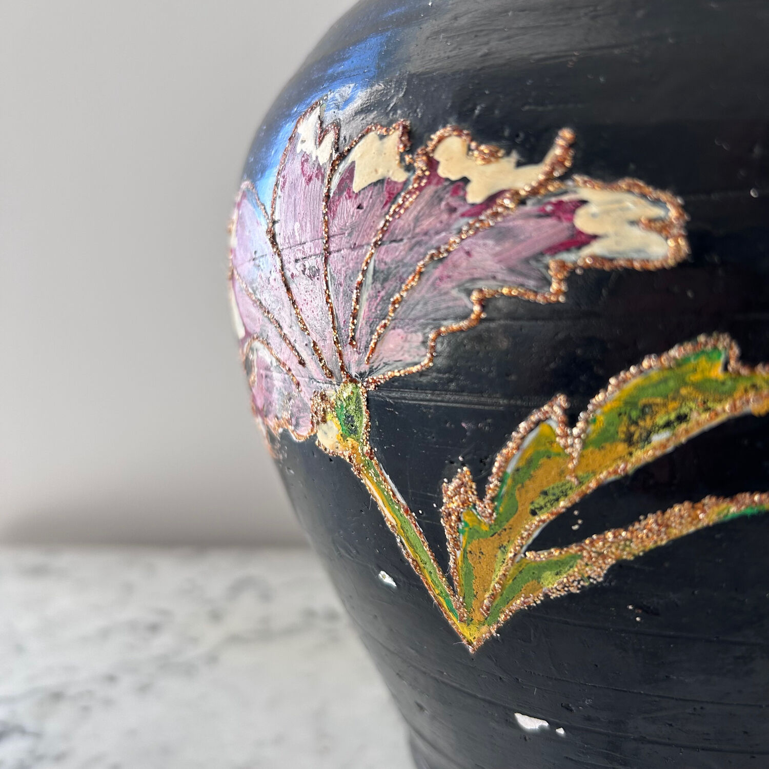 Black water jug with floral decoration