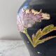 Black water jug with floral decoration