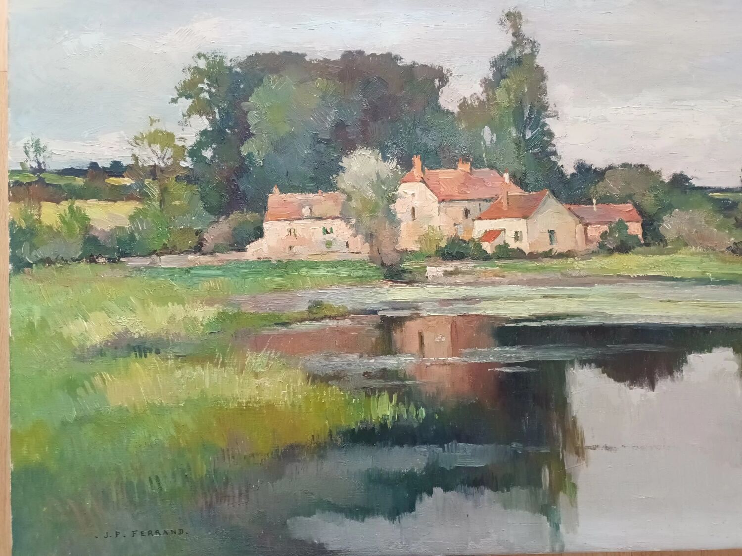 Oil on canvas by JP Ferrand: hamlet reflected in the pond