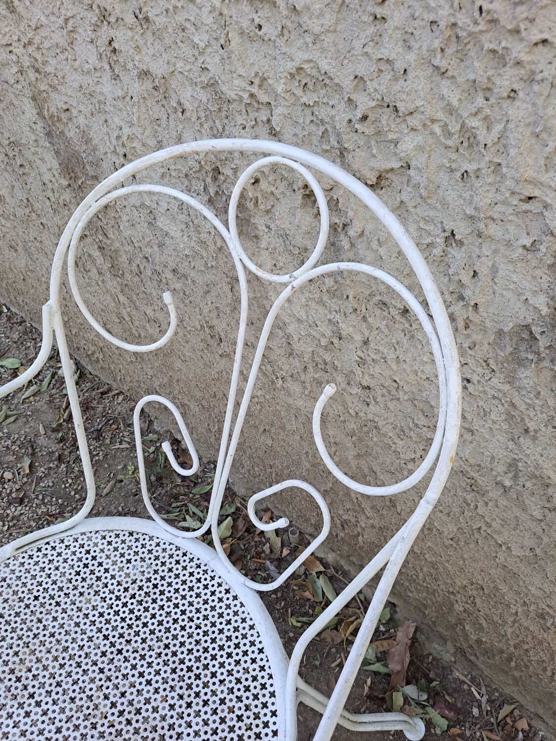 Pair of old white iron armchairs