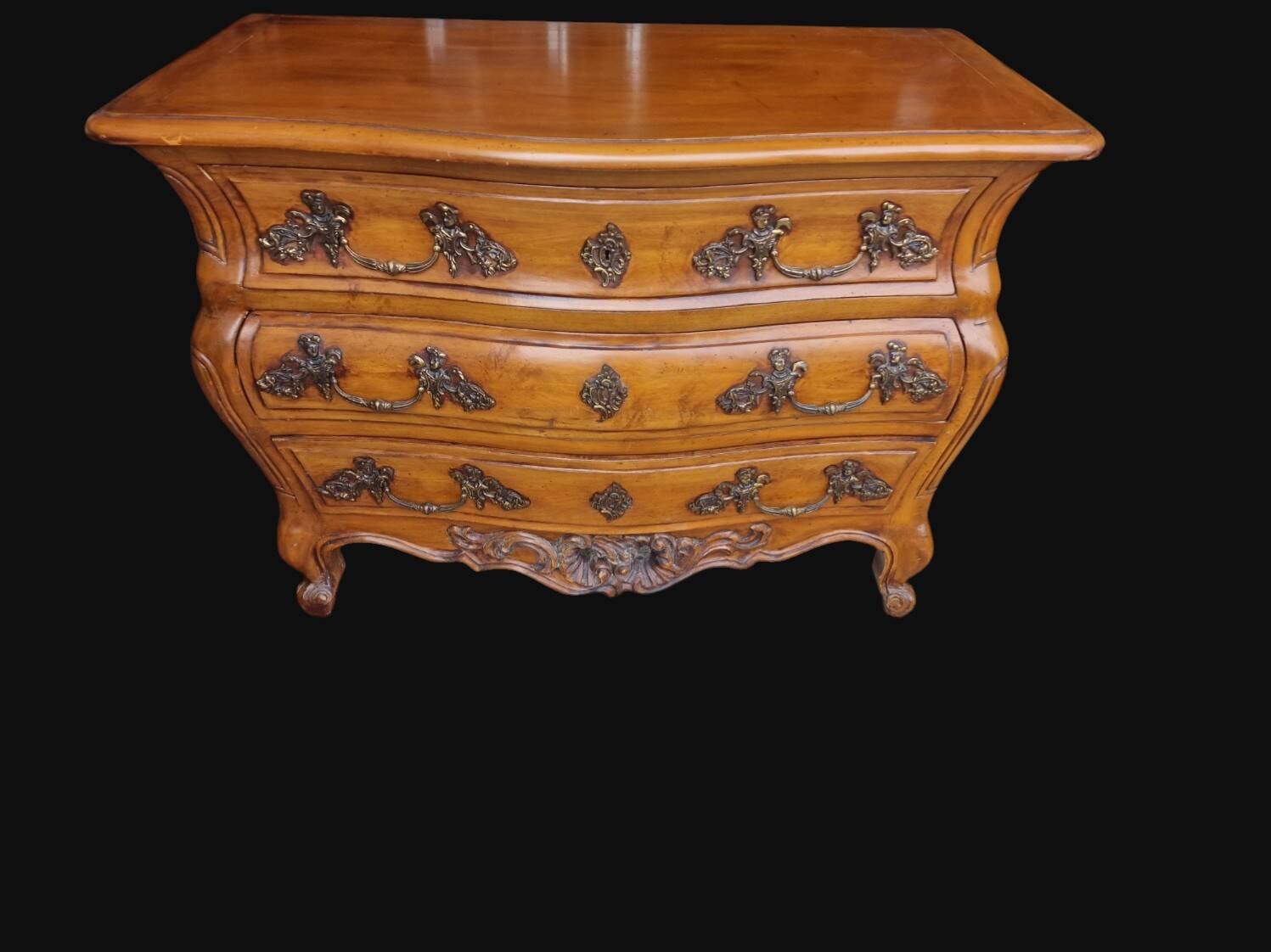 Solid wood commode in an antique style.