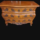 Solid wood commode in an antique style.