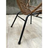 Pair of rattan shell chairs with metallic feet