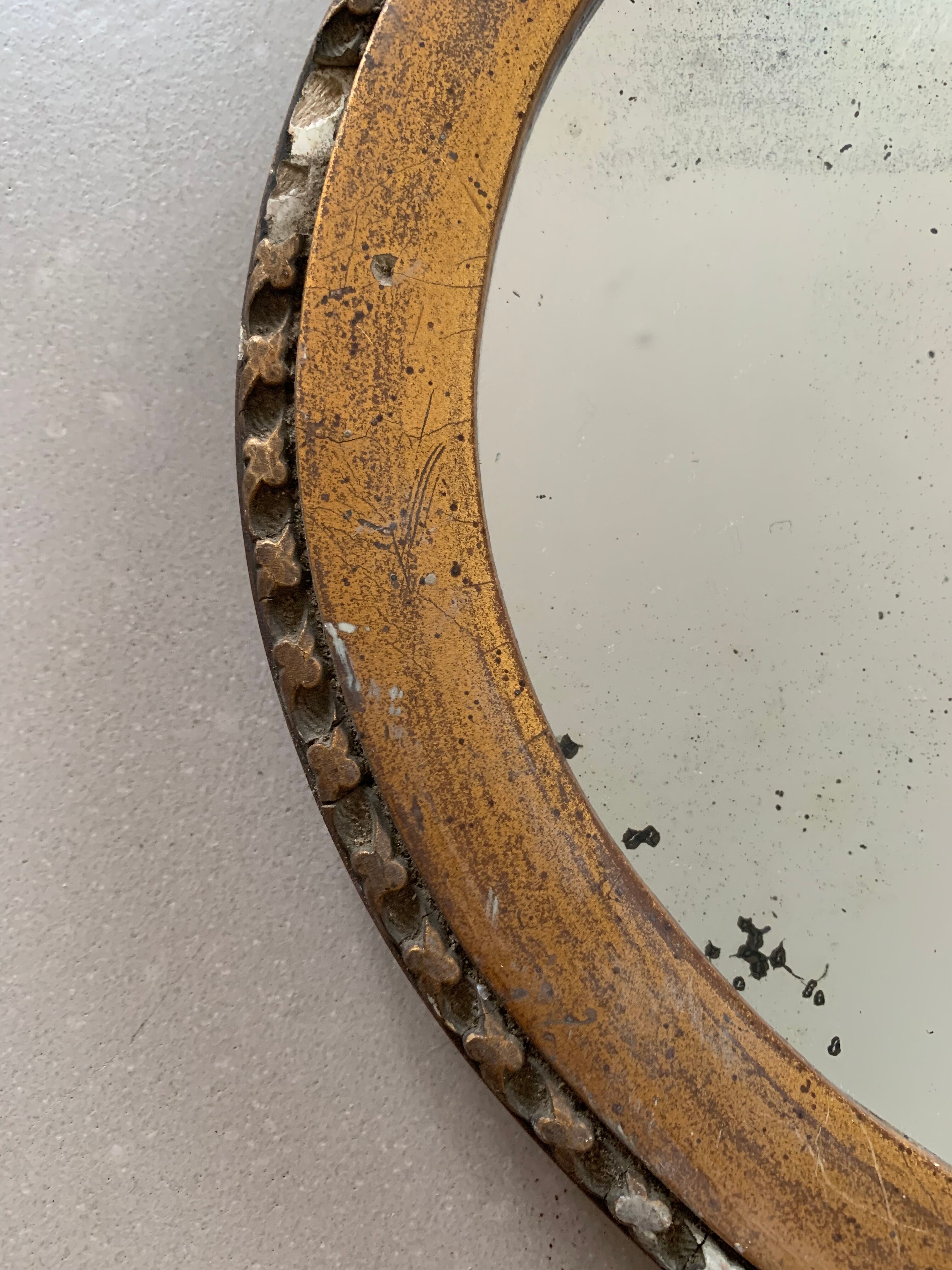 Old oval mirror stitched