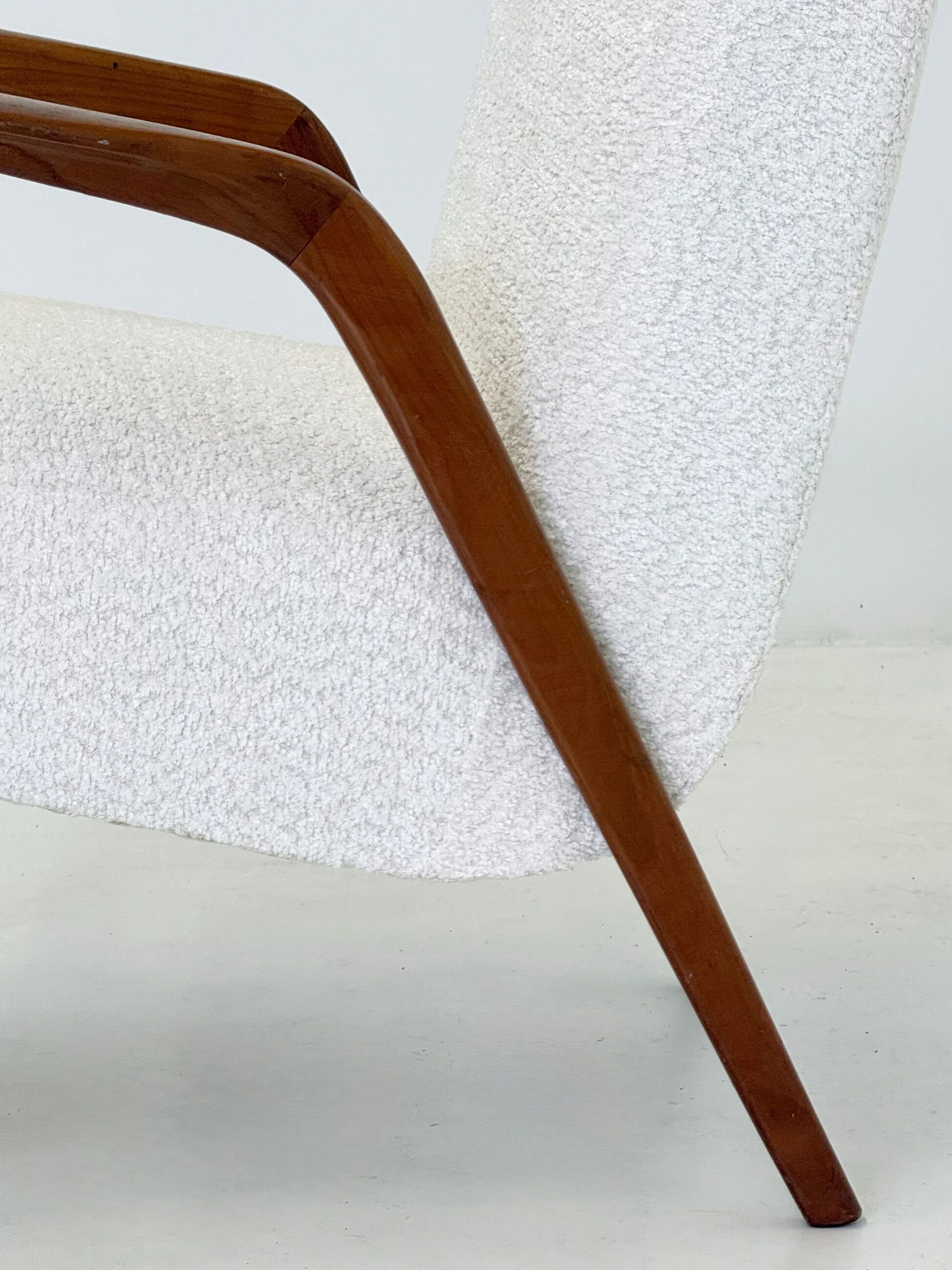 Italian mid-century lounge chair in cherry wood with white bouclé