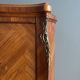 Louis XV wardrobe in floral marquetry and bronze.