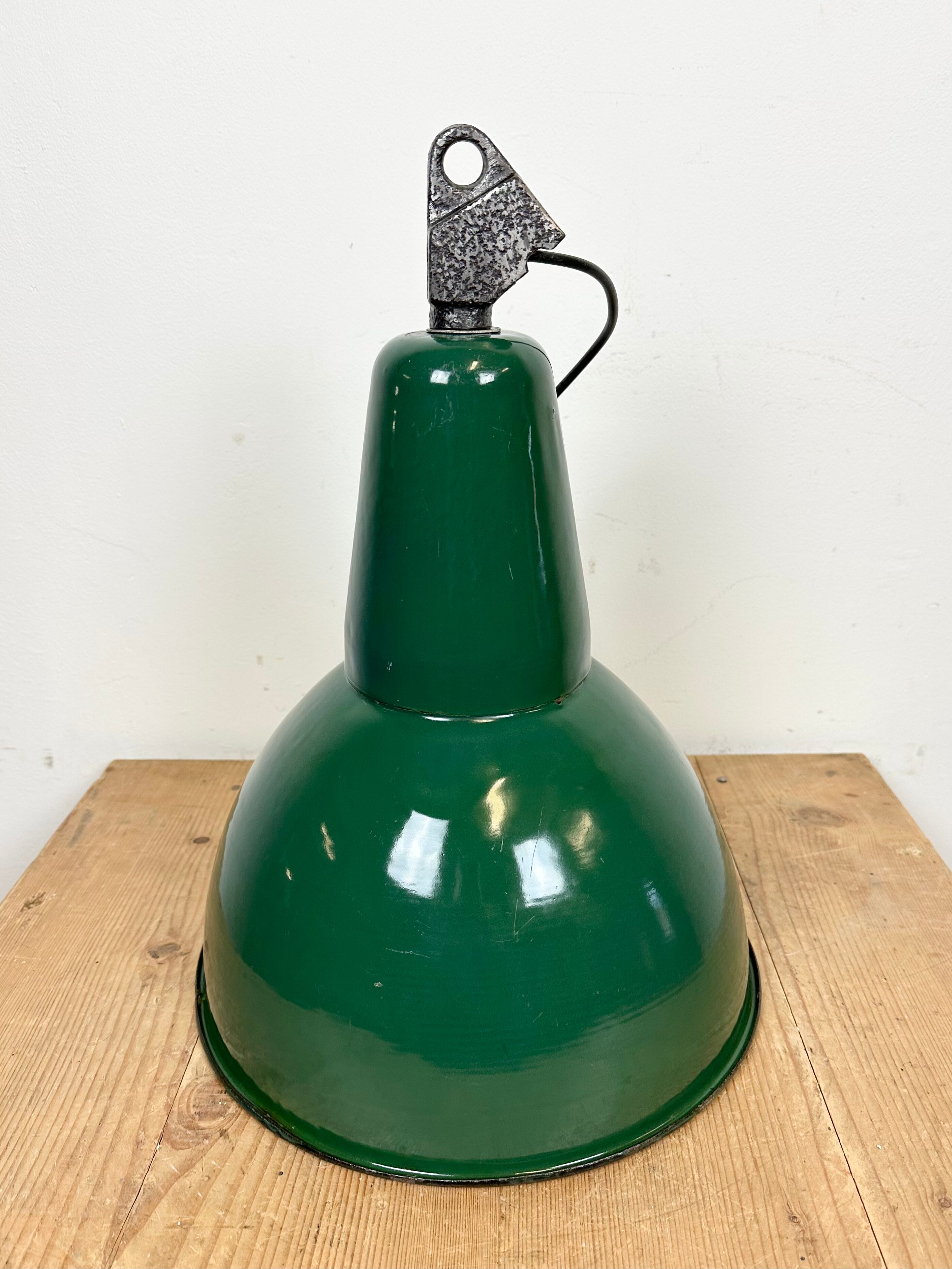 Industrial green enamel factory lamp with cast iron top, 1960s