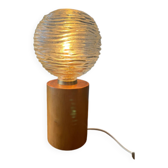 Cylindrical solid wood table lamp with globe