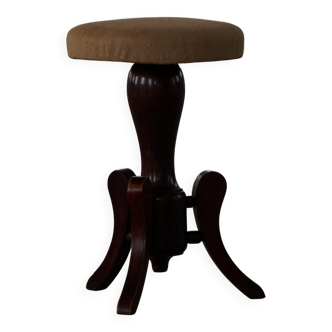 Adjustable Victorian-style piano stool with a jute fabric seat, early 20th century.