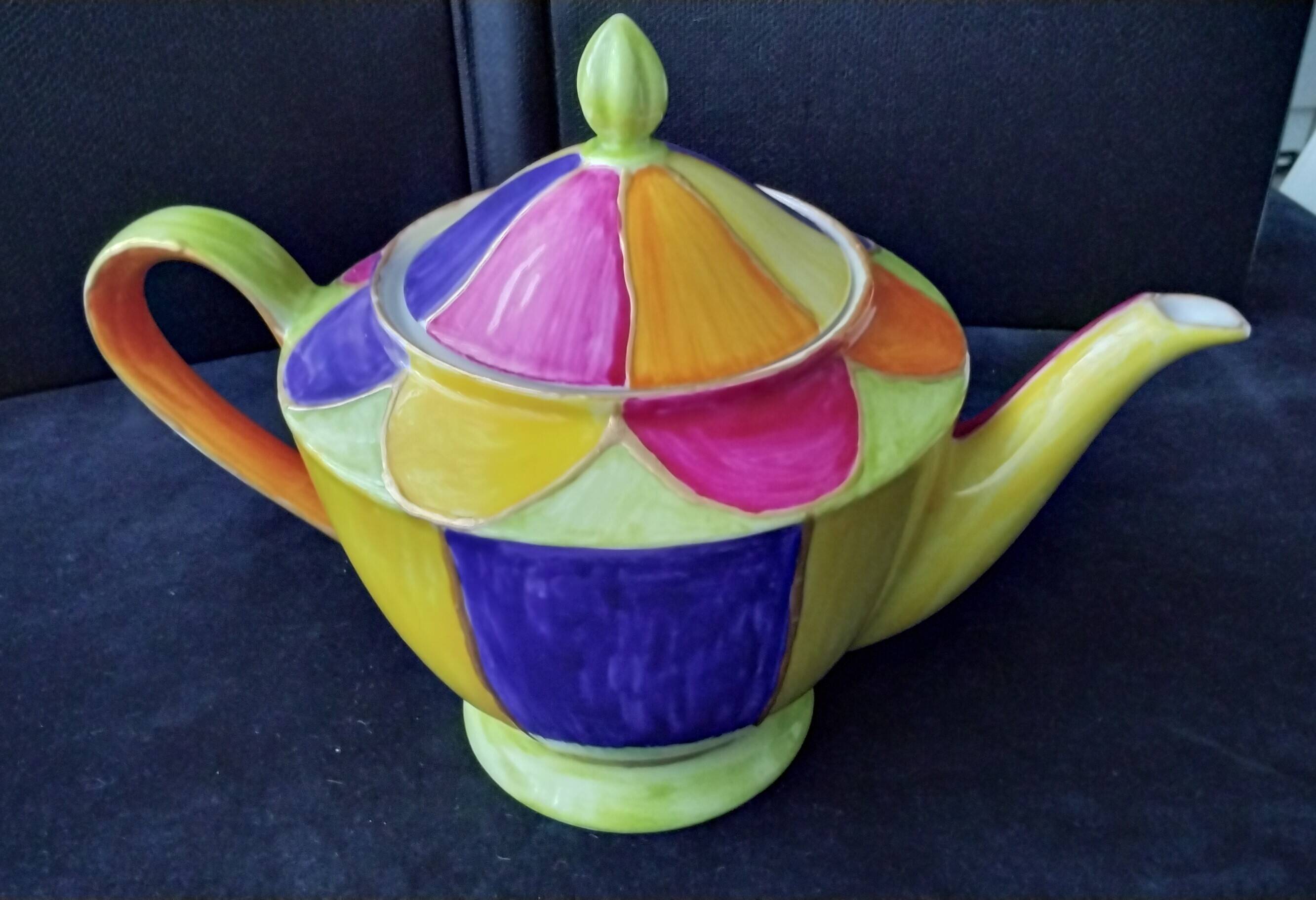 Polychrome porcelain teapot hand-painted.
