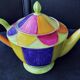 Polychrome porcelain teapot hand-painted.