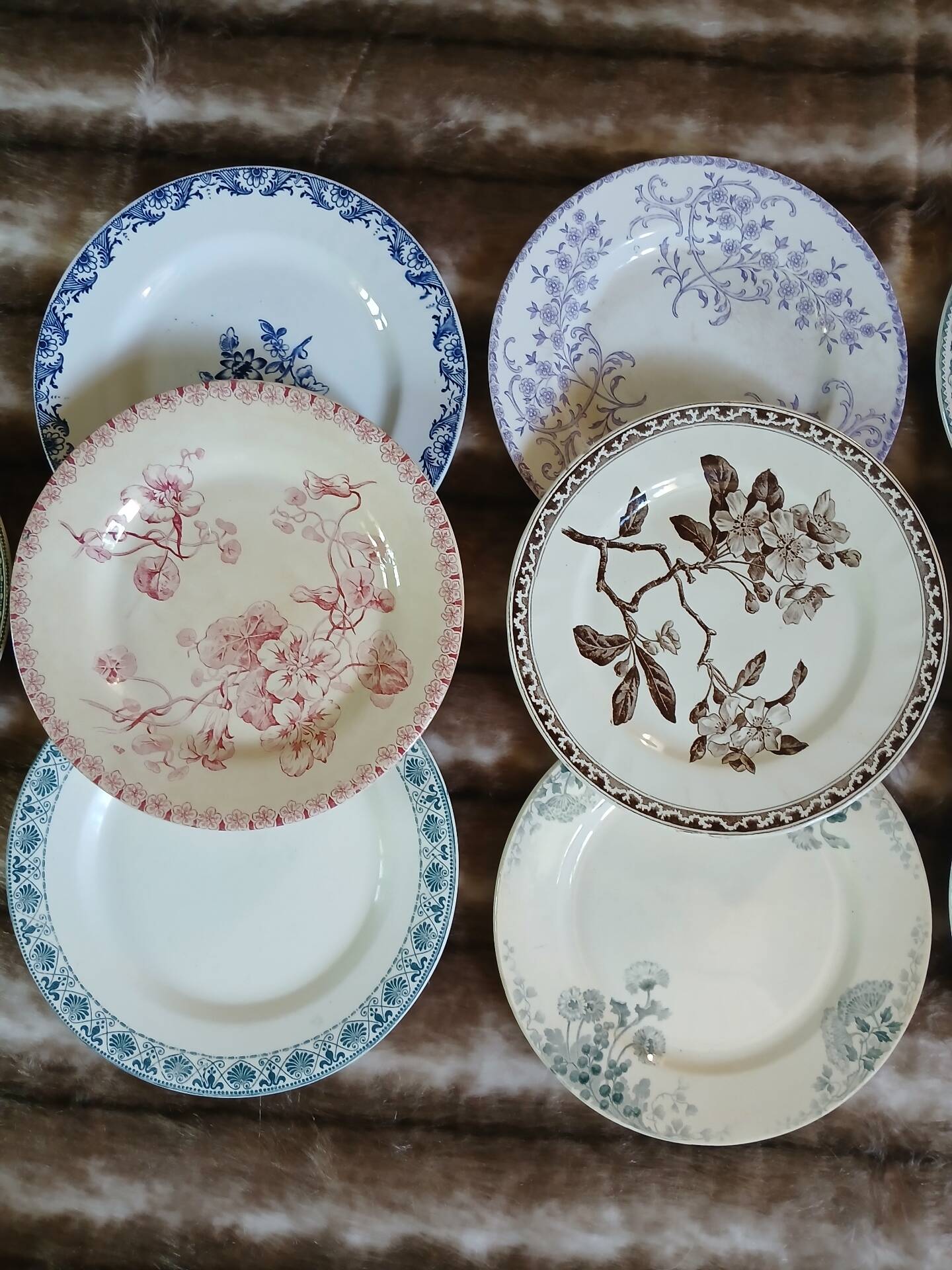 13 mismatched flat plates in ironstone