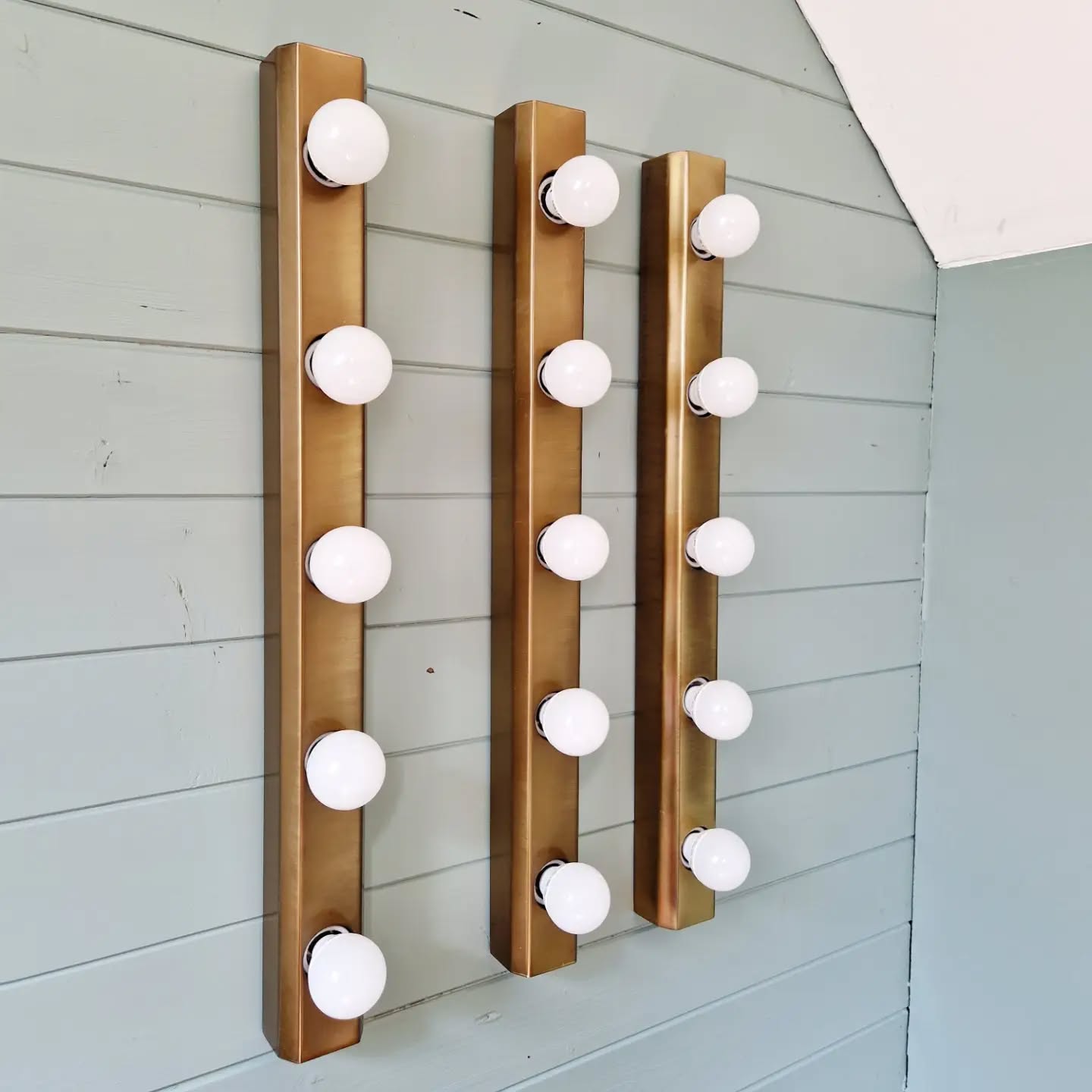Set of three wall sconces in solid brass, 1970s-80s.