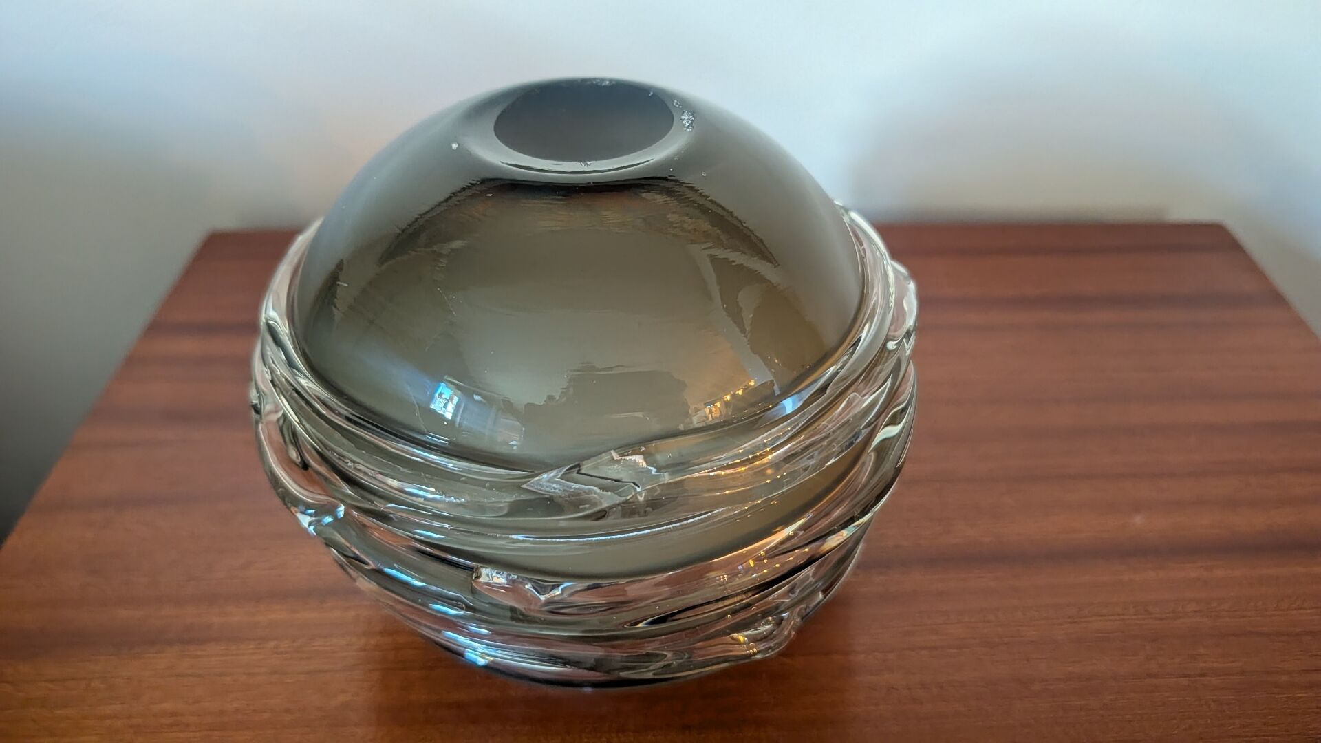 Smoky glass spherical vase with spiral applications from the 1970s.