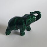 Small emerald green ceramic elephant.