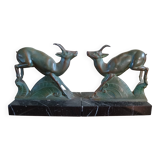 Pair - Chamois metal bookends with green patina & black marble base