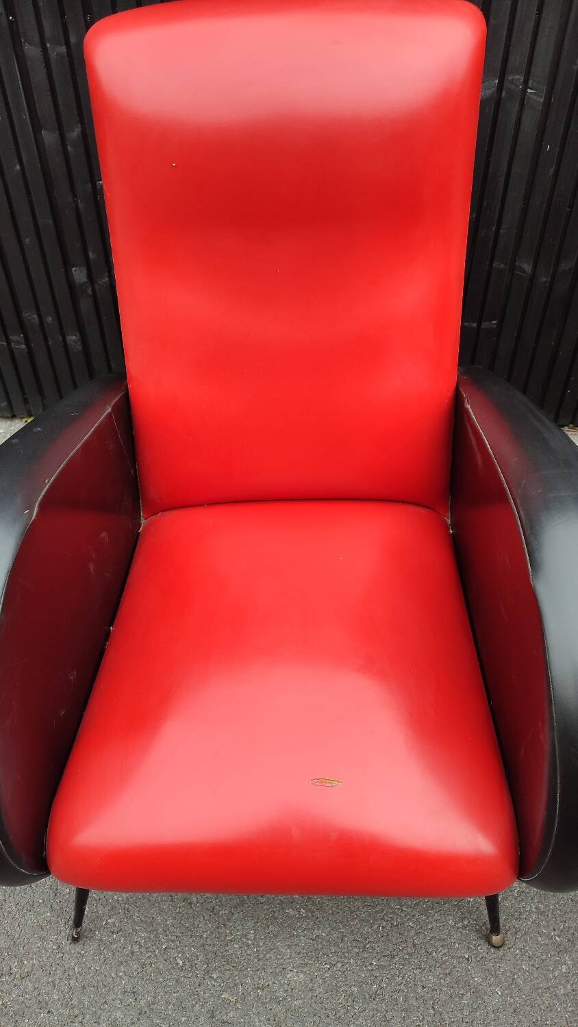 Pair of red and black faux leather armchairs