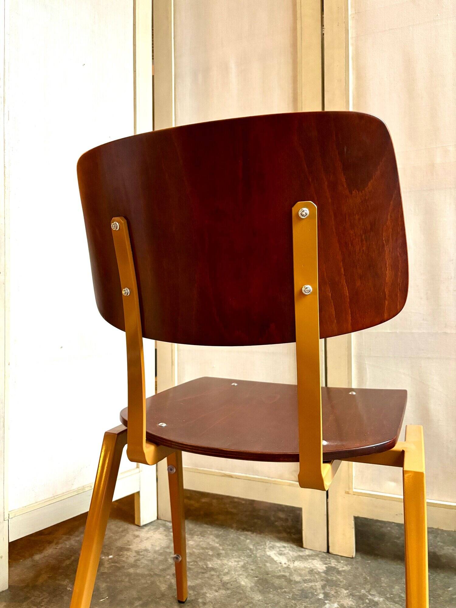 Chair in dark wood and ocher metal