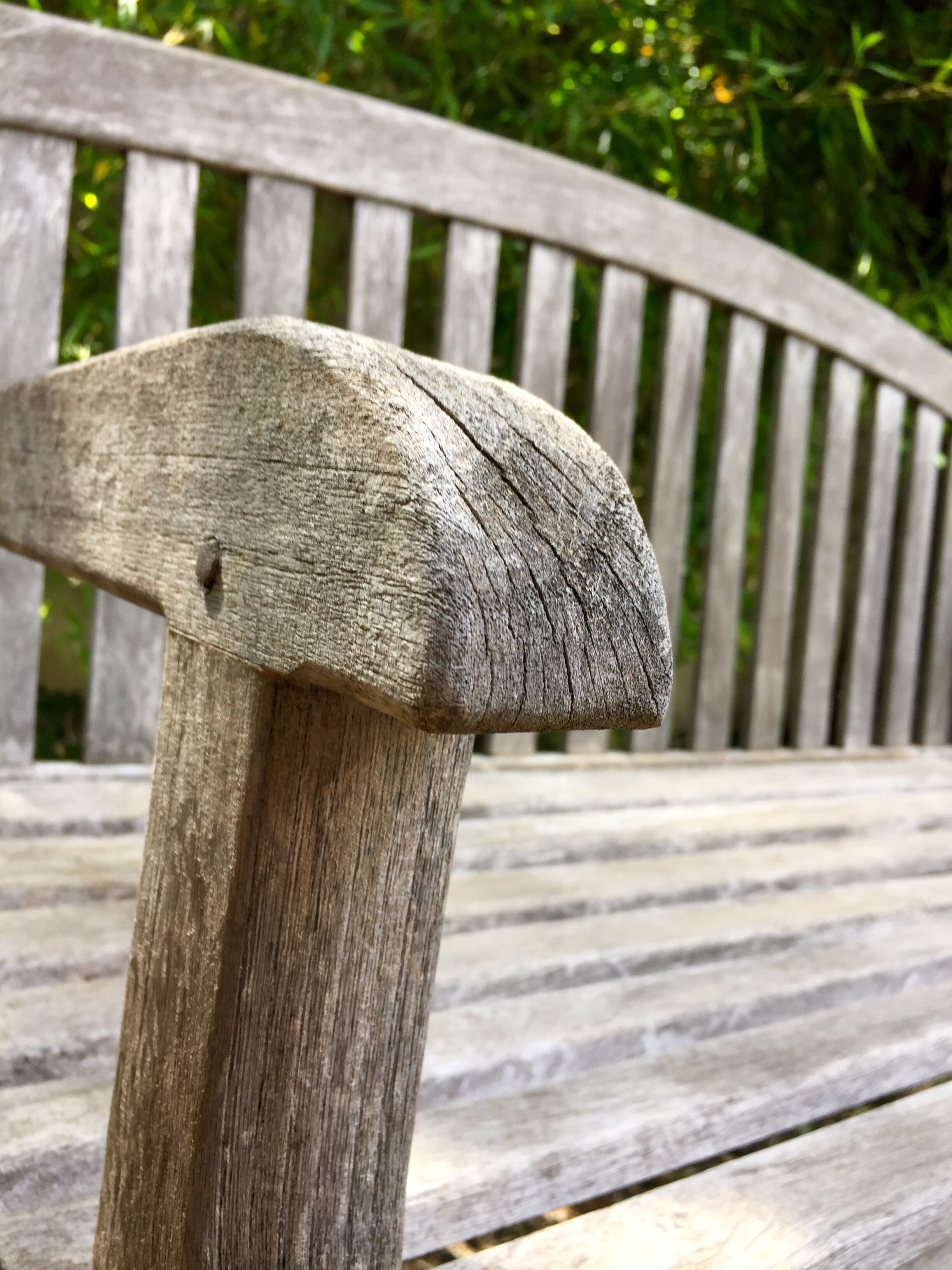 Vintage wooden garden bench with wheels