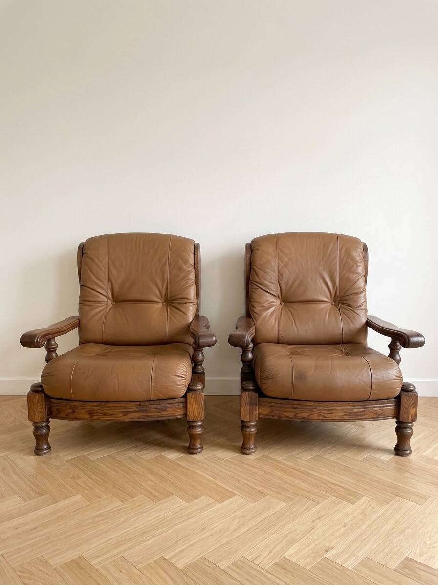 Pair of vintage 1970s armchairs in solid oak and cognac faux leather.