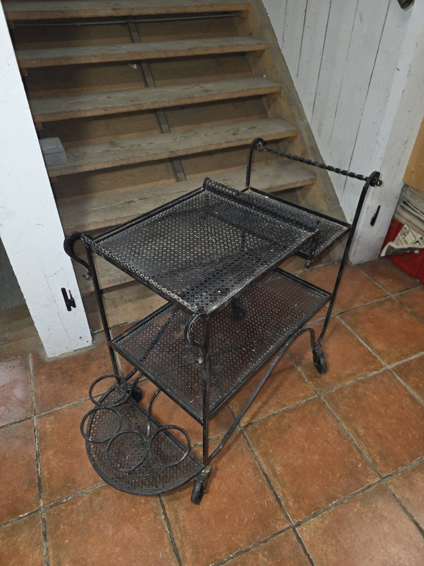 Perforated wrought iron rolling dessert trolley