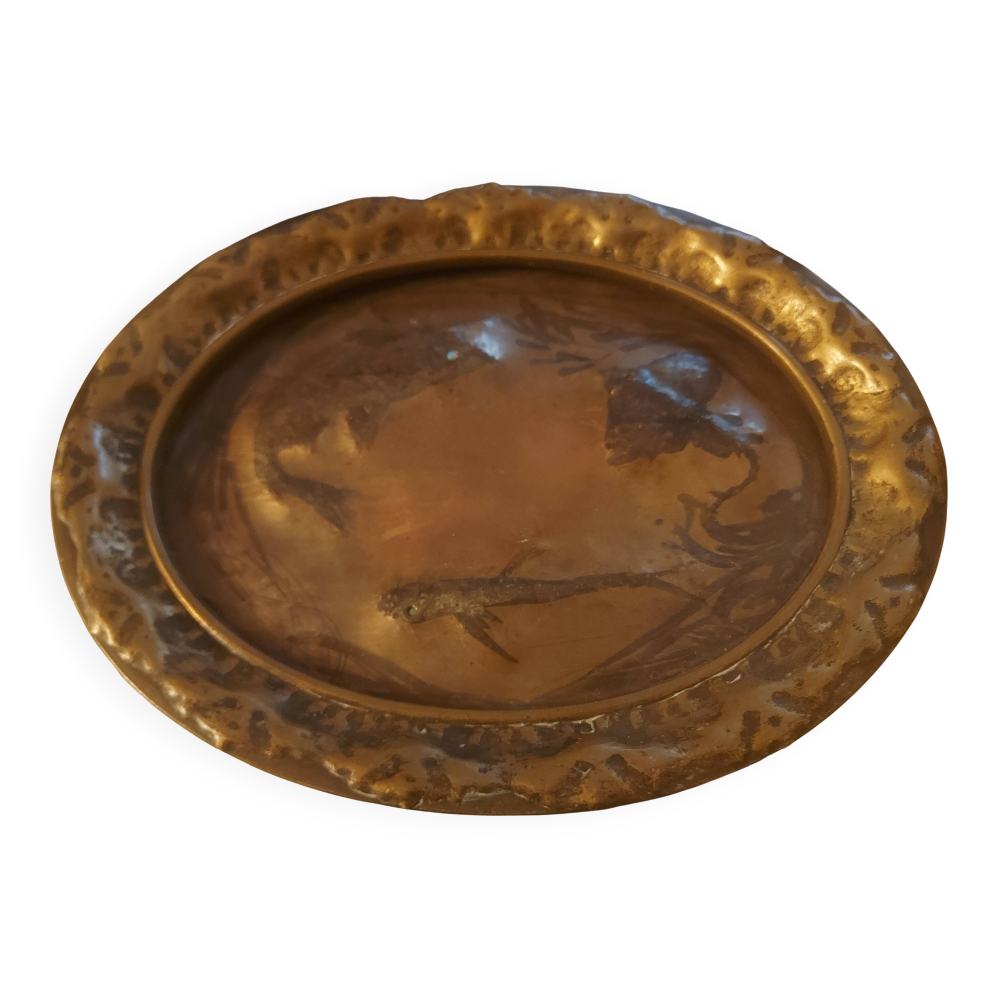 Decorative copper repoussé plate with marine motifs
