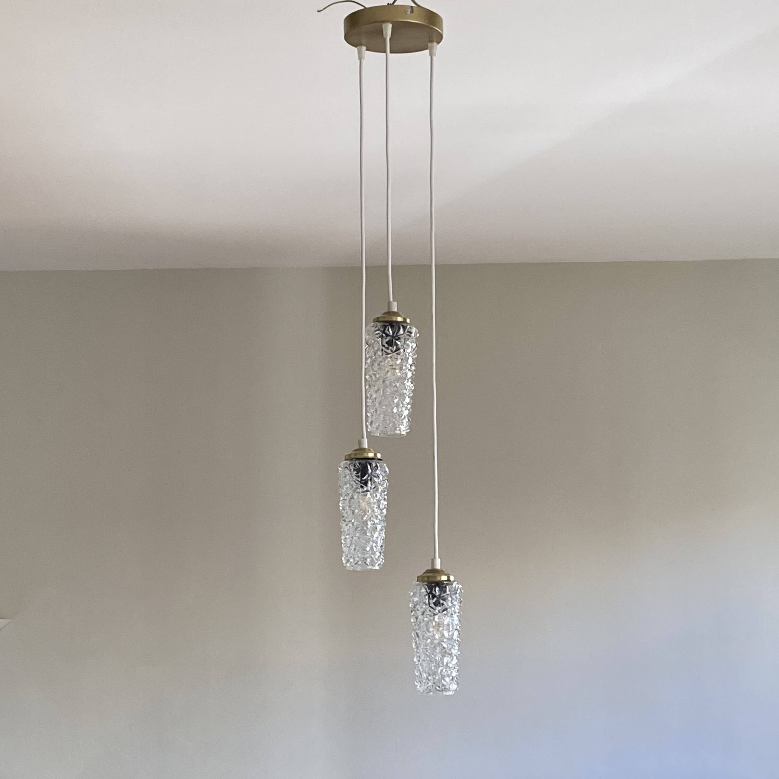 Cascade chandelier with 3 antique glass tulips, staircase