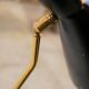 Vintage "Diabolo" wall apply in black metal and brass
