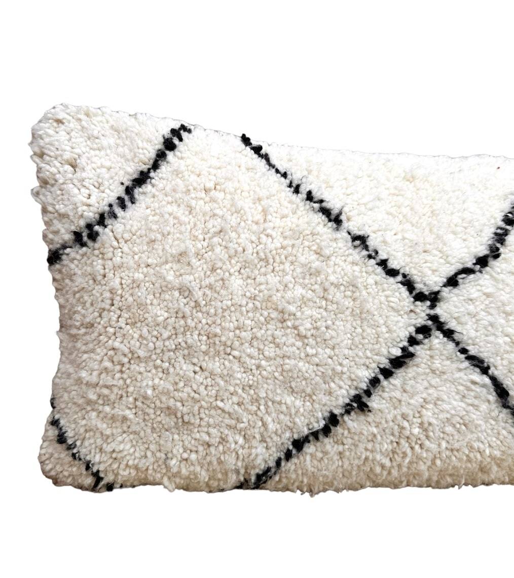 Bohemian wool pillow cover on a Beni Ourain Berber cushion. The cushion cover