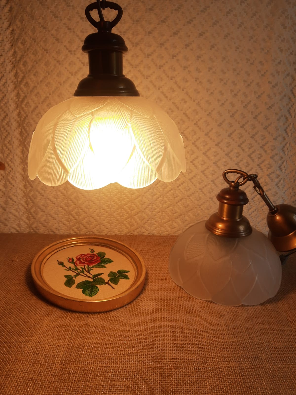 Pair of frosted glass flower pendant lights with vintage wood and brass
