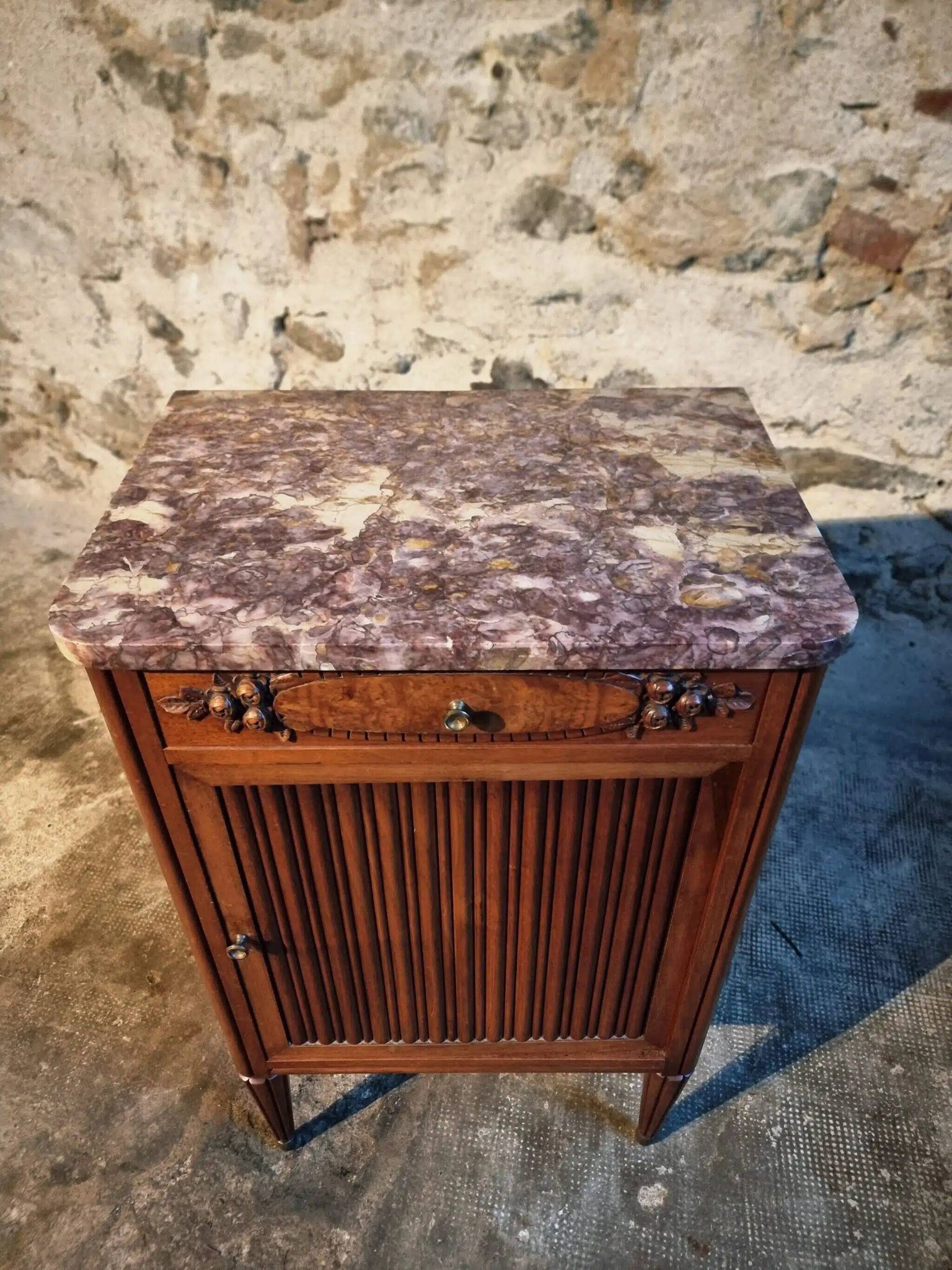 French antique bedside table in walnut with a marble top and porcelain interior, early 20th century.