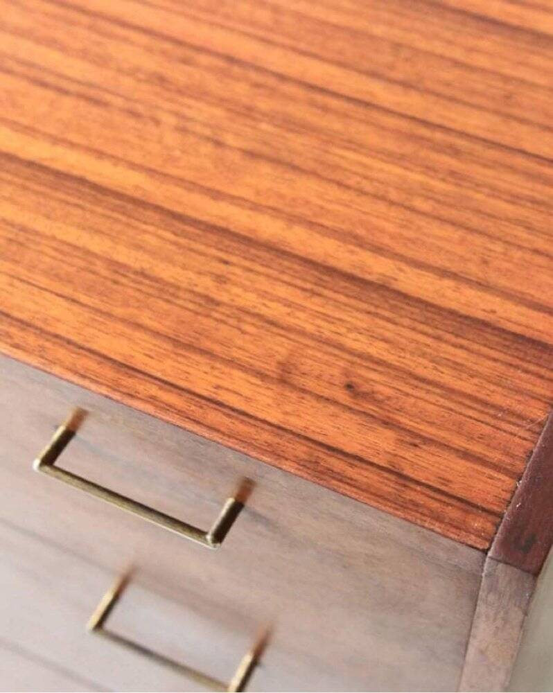 Mid-century teak chest of drawers in brown with four drawers, brass handles, 1960s.