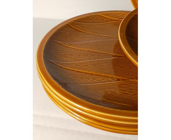 Ten plates in Salins slip with braided patterns 50s