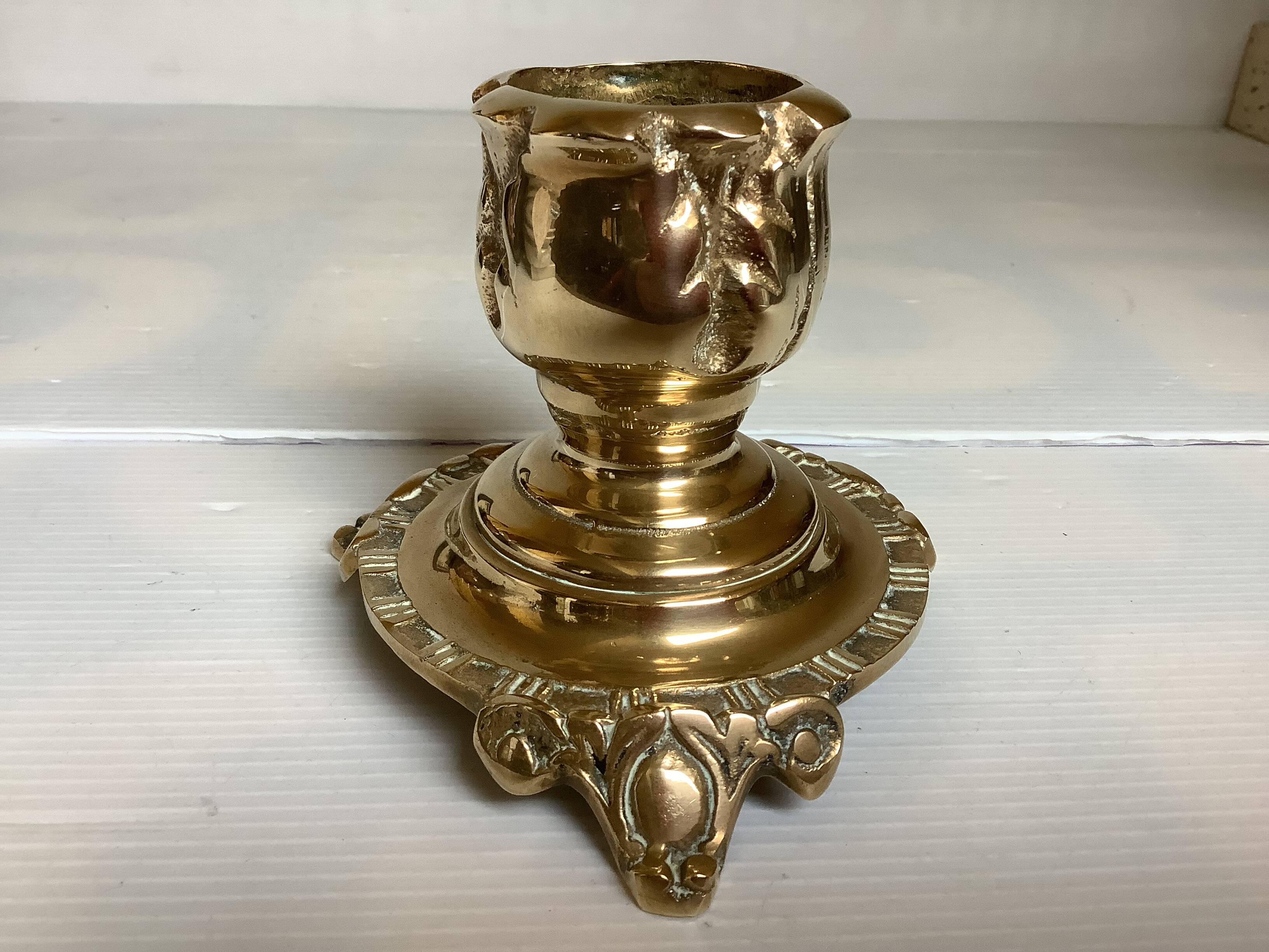 Tripod candlestick in worked bronze