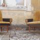 Pair of vintage 60s armchairs in black imitation leather and mustard toffee