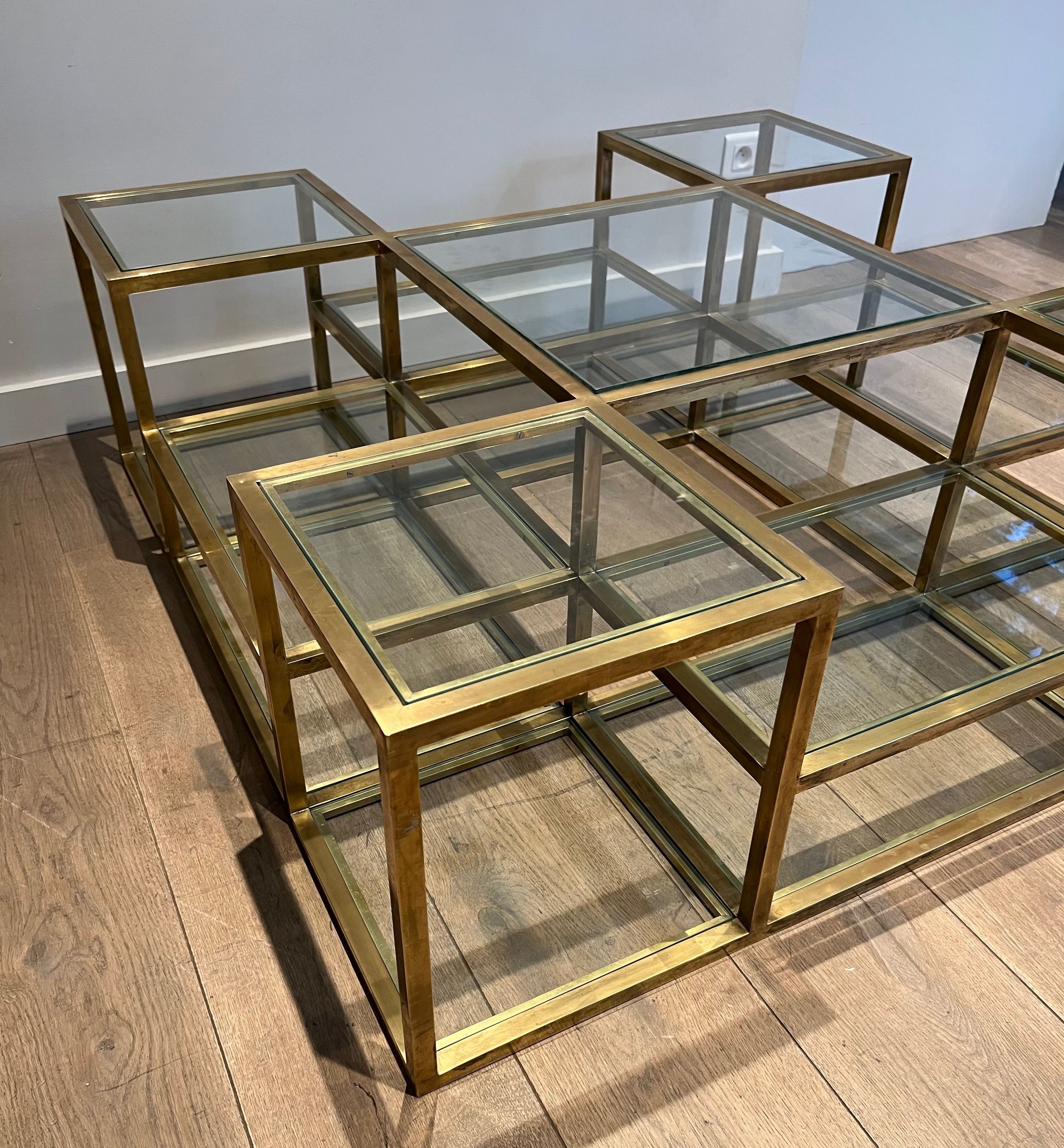 Important brass coffee table with multiple levels.