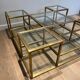 Important brass coffee table with multiple levels.