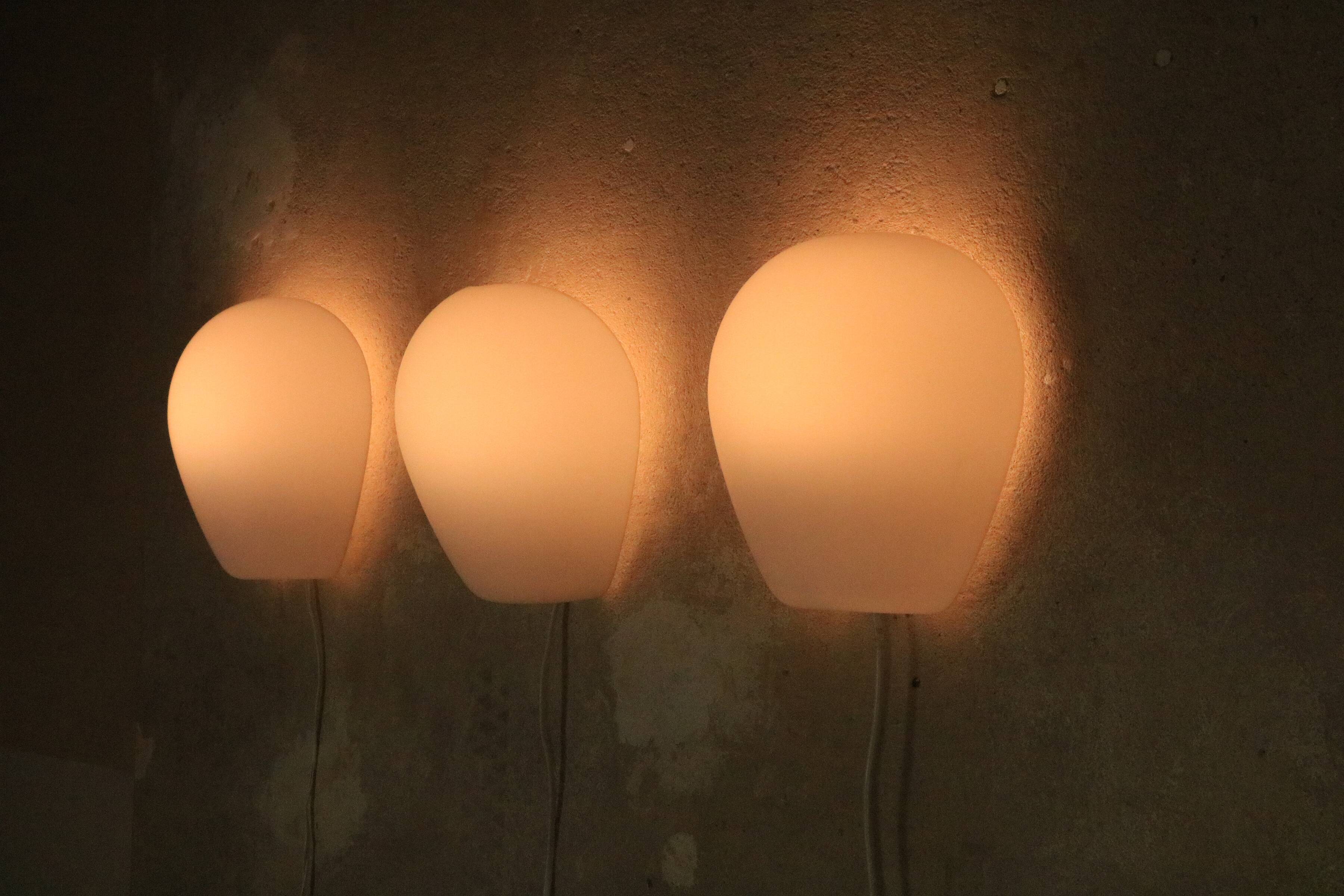 3 Wilhem Wagenfeld wall lamps, Peill & Putzler, "Muschel", 1950s