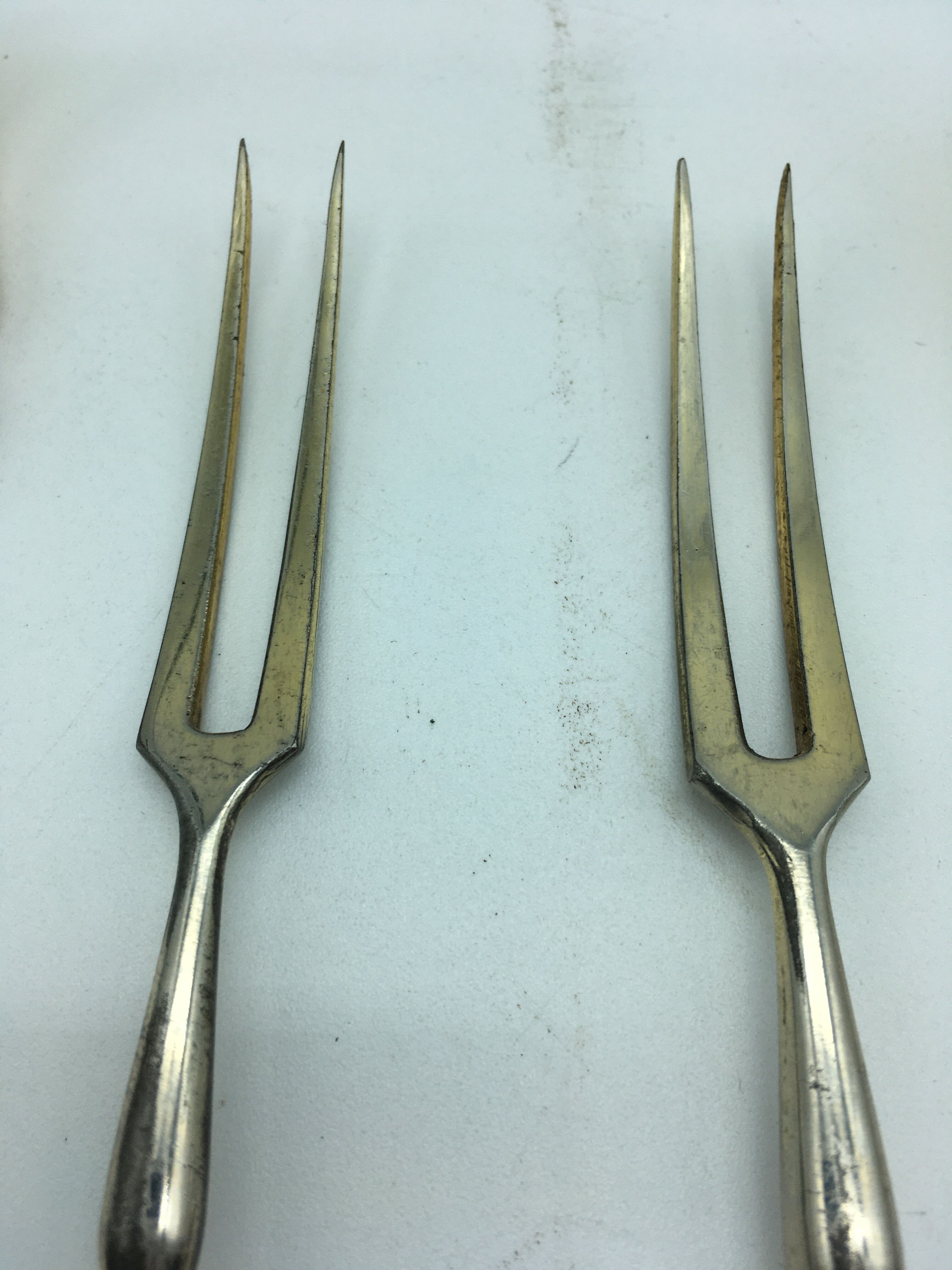 Box of filled silver salad cutlery