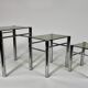 Tables in chrome metal and tinted glass. year 70