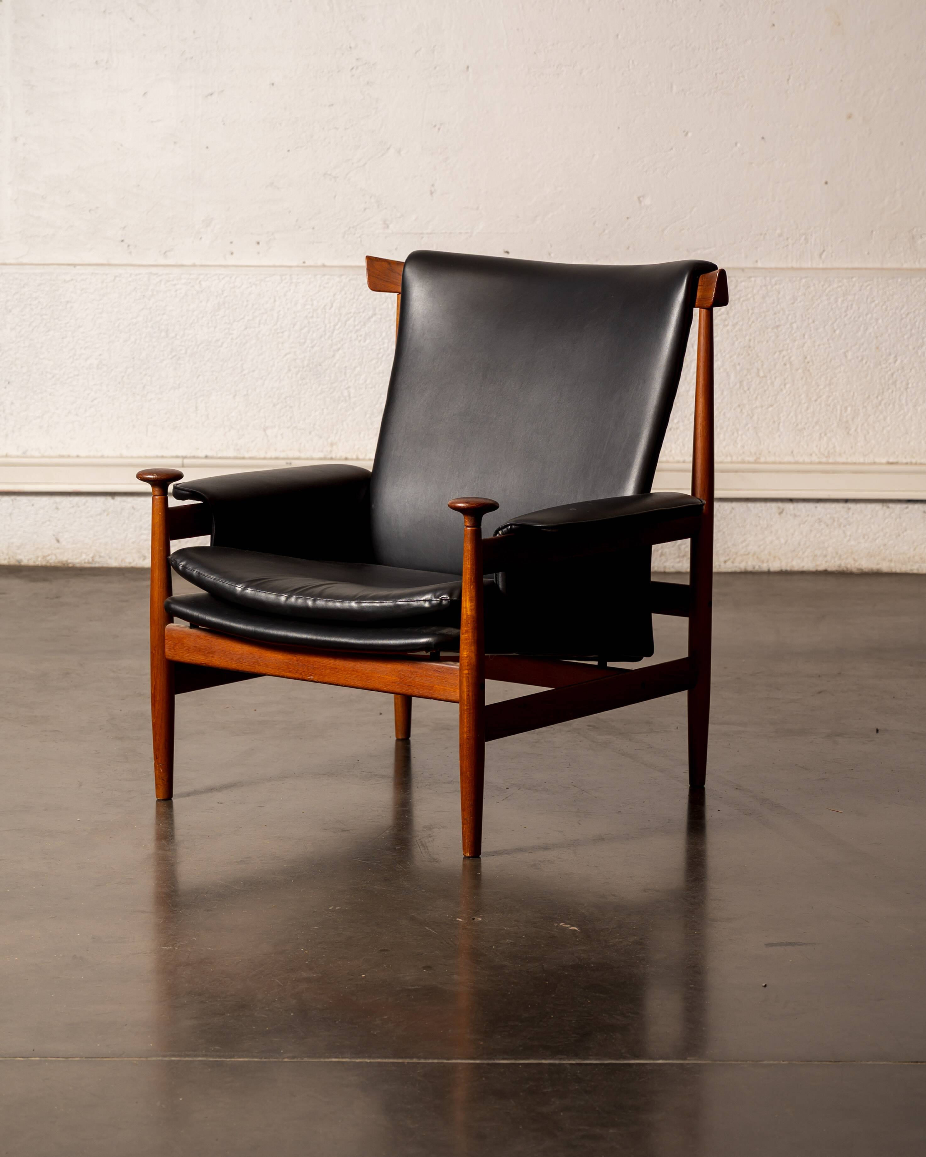 Finished Juhl armchair and its ottoman.